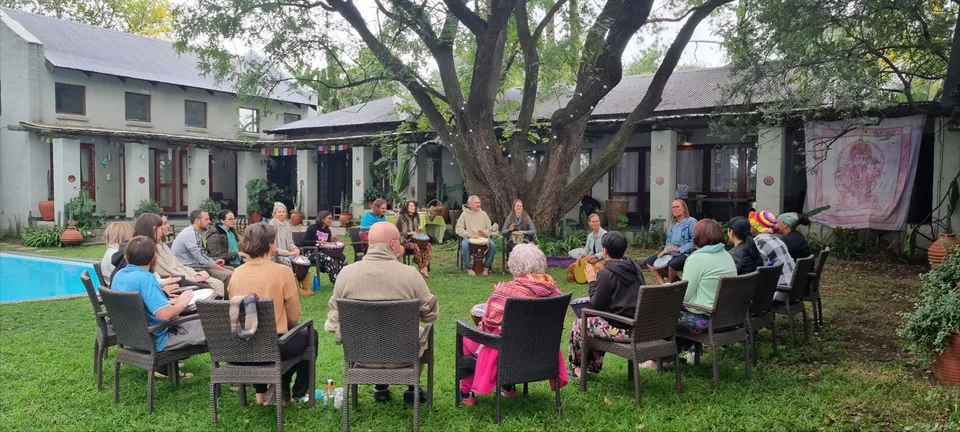 Outdoor drum circle at Windrush Studio